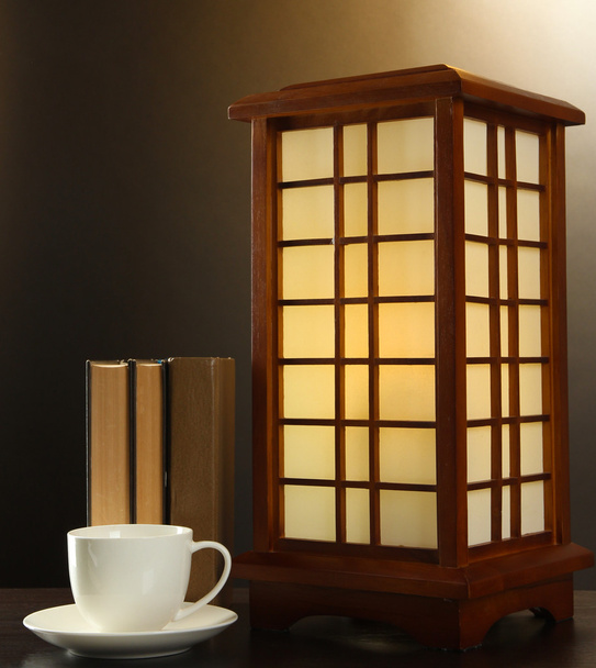Japanese table lamp on brown background - Photo, image