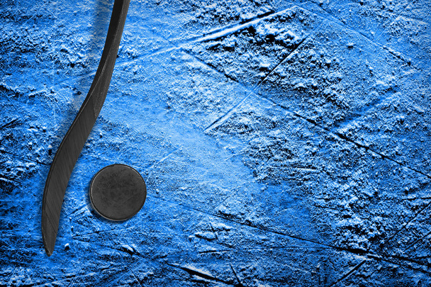 Hockey stick and puck on blue ice - Zdjęcie, obraz