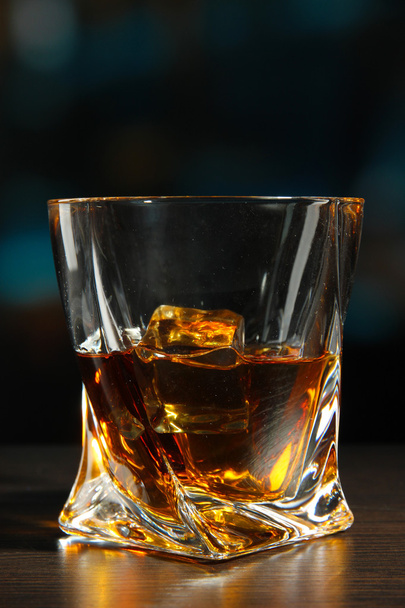 Glass of whiskey, on dark background - Фото, изображение