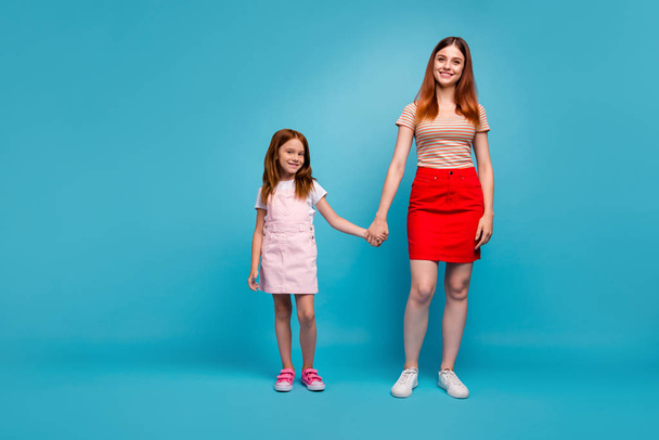 Full length photo of foxy little lady and her mom ready come out for walk wear casual clothes isolated blue background - Foto, Imagem