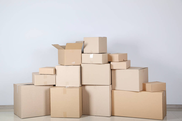 Cardboard boxes on grey background - Фото, зображення