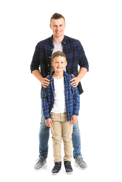 Portrait of happy father and son on white background - 写真・画像