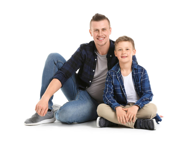 Portrait of happy father and son on white background - Фото, зображення