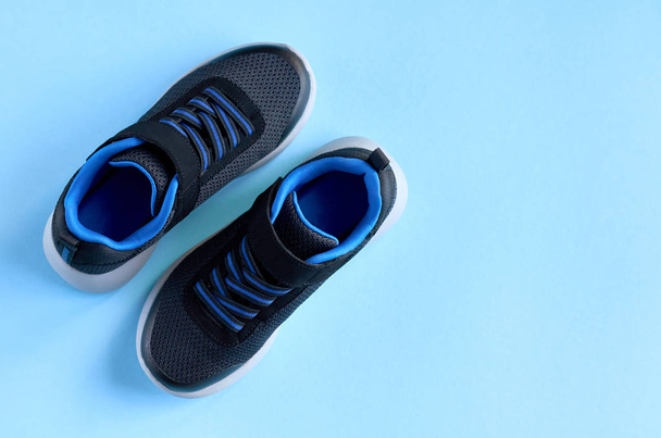 Sneakers on blue background composition, shoes for run. - Foto, Imagen
