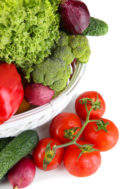 Fresh vegetables in white wicker basket close up - Fotó, kép