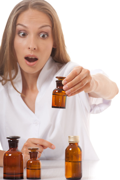 Woman doctor with medication in glass bottles - Foto, afbeelding