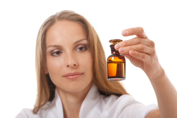 Woman doctor with medication in glass bottles - Photo, image