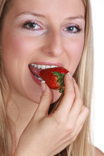 Woman with strawberry - Фото, изображение