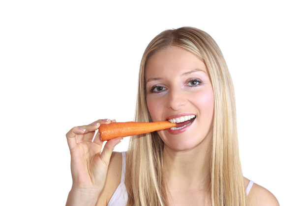 Woman with carrot - Фото, зображення