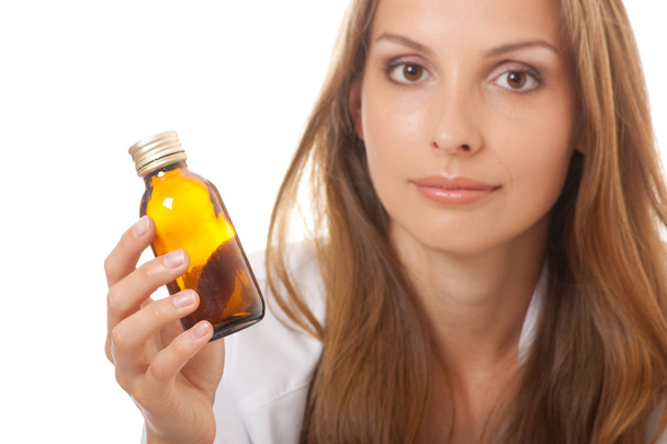 Woman doctor with medication in glass bottles - Foto, immagini