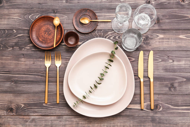 Beautiful table setting on wooden background - Foto, Imagen