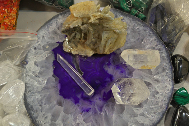 Clear quartz natural healing crystals displayed on table - Photo, Image