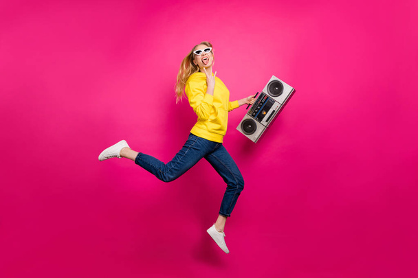 Full size photo of cool lady jumping high funky rocker dj wear casual outfit isolated pink background - Foto, imagen