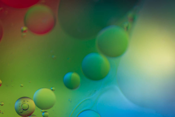 Defocused rainbow abstract background picture made with oil, water and soap - 写真・画像