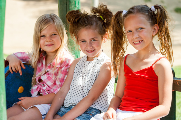 Three little girl friends in park. - Photo, Image