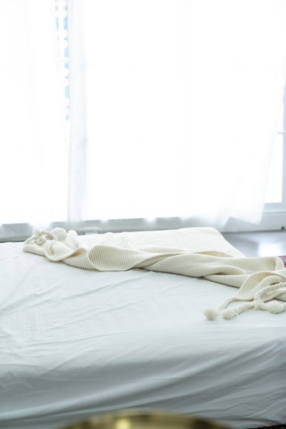 stylish modern interior with cozy bed in white colors  - Zdjęcie, obraz