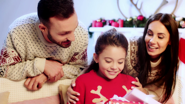 parents giving presents to cheerful daughter  - Footage, Video