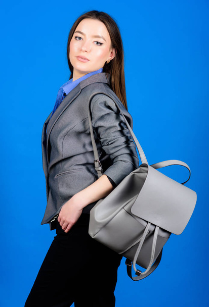 Backpack fashion trend. Woman with leather knapsack. Stylish woman in jacket with leather backpack. Formal style accessories. Backpack for daily modern urban life. Girl student in formal clothes - Foto, Imagem