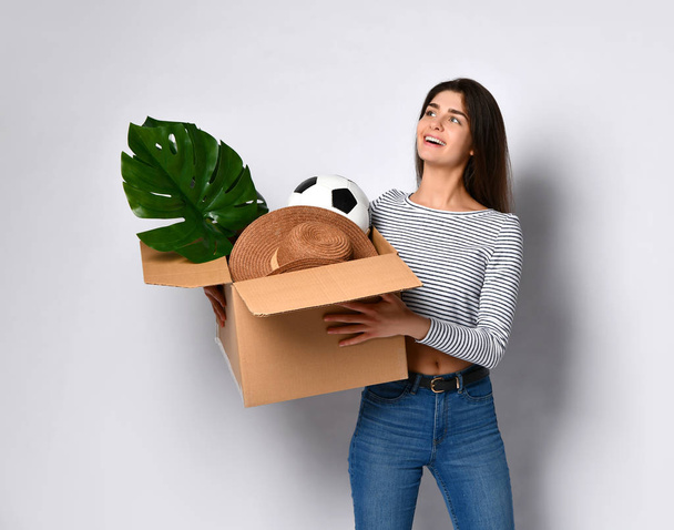 Young woman holding box with things. - Photo, Image