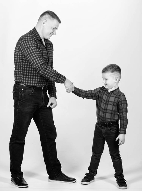 Happiness being father of boy. Dad and adorable child. Parenthood concept. Fathers day. Father example of noble human. Cool guys. Father little son red shirts family look outfit. Best friends forever - Фото, изображение