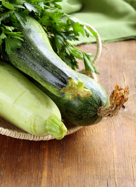 Fresh green zucchini on a wooden table - Foto, immagini