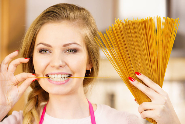 Woman holding long pasta - Photo, Image