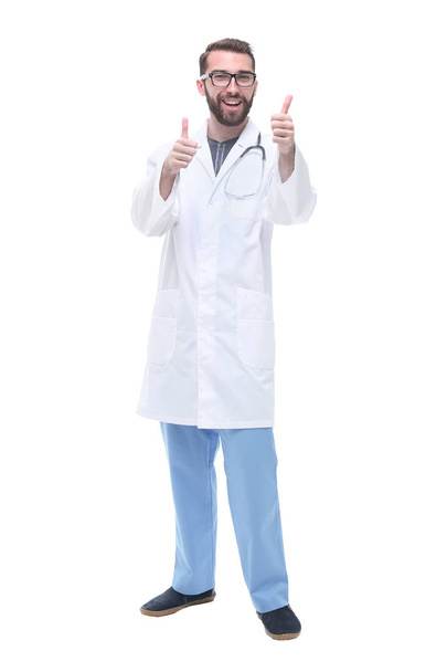 in full growth. smiling male doctor showing thumbs up - Foto, Bild