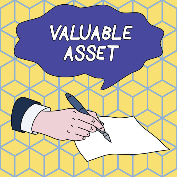 Text sign showing Valuable Asset. Conceptual photo Your most valuable asset is your ability or capacity Male Hand Formal Suit Holding Ballpoint Pen Blank Piece of Paper Writing. - Photo, Image
