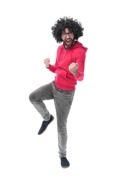 in full growth. portrait of cheerful curly-haired guy. - Foto, Imagen