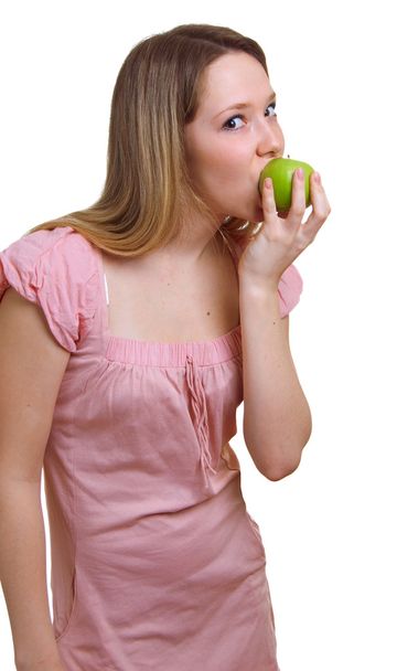 Girl with a green apple - 写真・画像