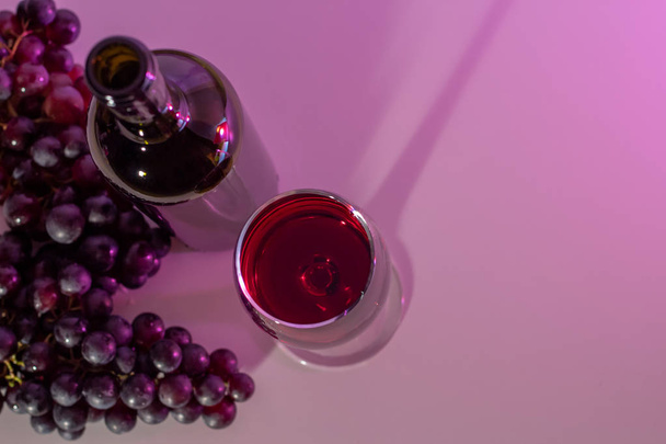 A bottle of wine and a glass - Fotó, kép