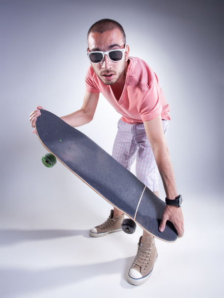 crazy guy with a skateboard making funny faces - Foto, Imagem