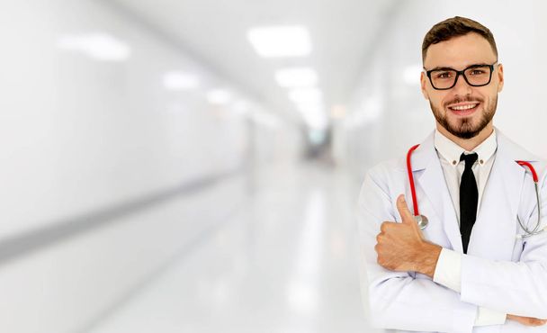 Young male doctor working at hospital. Medical healthcare and doctor staff service. - Foto, Imagen