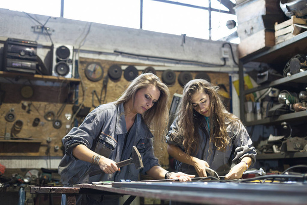 two women working in workshop - Photo, image