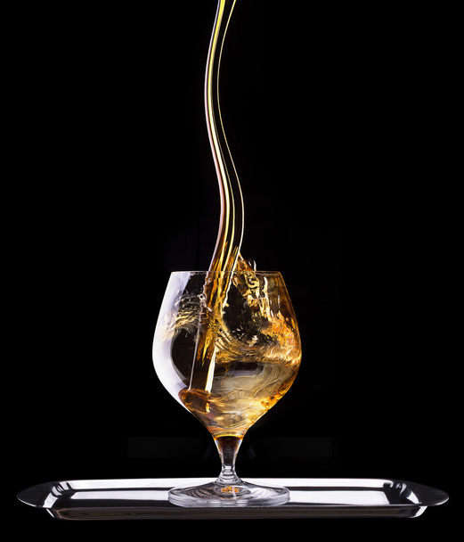 Cognac or brandy on a black - Photo, Image