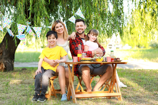 Happy family having picnic on summer day - Valokuva, kuva