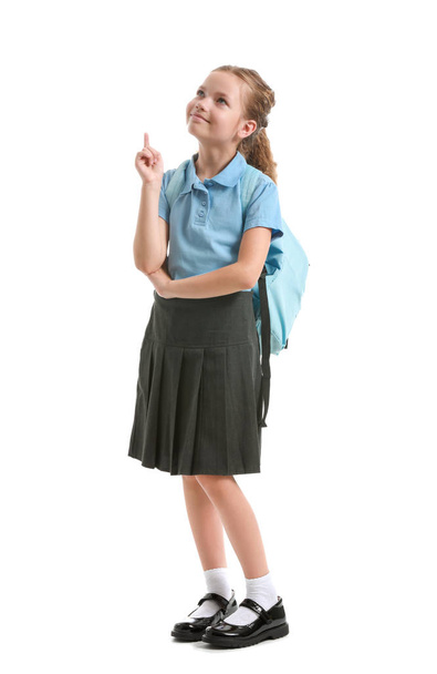 Cute little schoolgirl on white background - Foto, Imagem