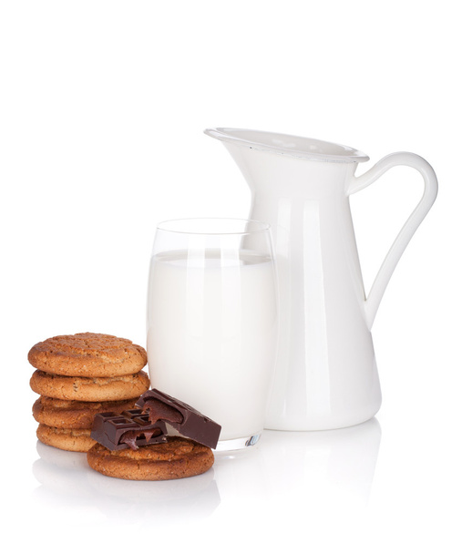 Jug and glass of milk, cookies and chocolate - Фото, зображення