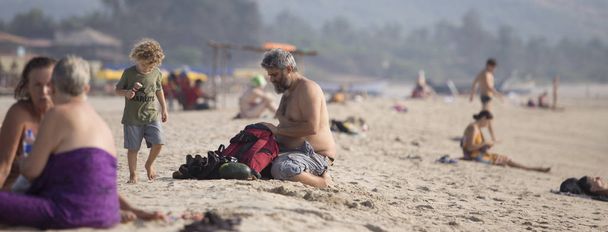 Goa, Arambol, Mandrem / India - December 2018: people relax on t - Fotoğraf, Görsel