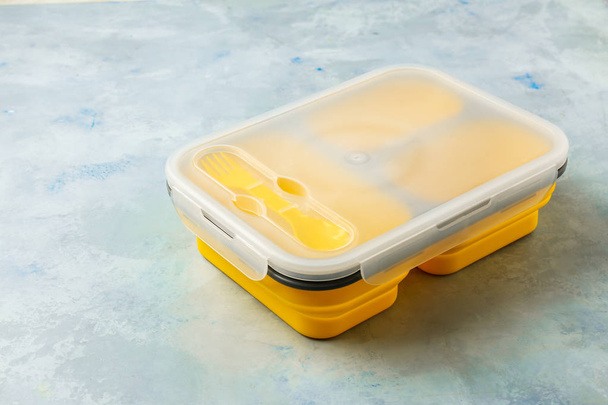 Plastic lunch box on light background - Valokuva, kuva