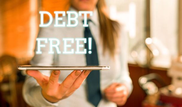 Word writing text Debt Free. Business concept for does not owning any money or things to any individual or companies Blurred woman in the background pointing with finger in empty space. - Photo, Image