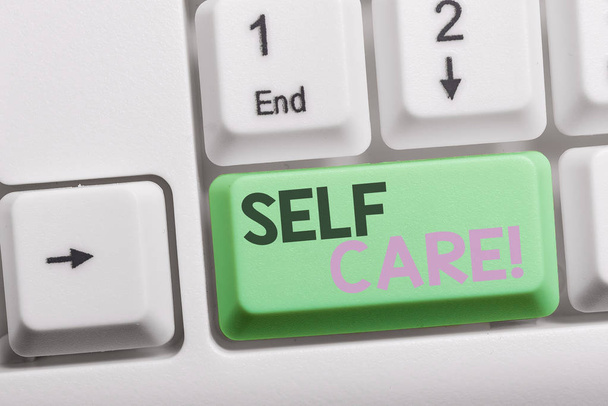 Text sign showing Self Care. Conceptual photo practice of taking action to preserve or improve ones own health White pc keyboard with empty note paper above white background key copy space. - Photo, Image