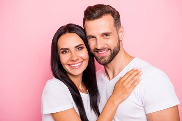 Close-up portrait of his he her she two nice attractive lovely charming cute shine cheerful cheery spouses embracing cuddling isolated over pink pastel background - Foto, imagen