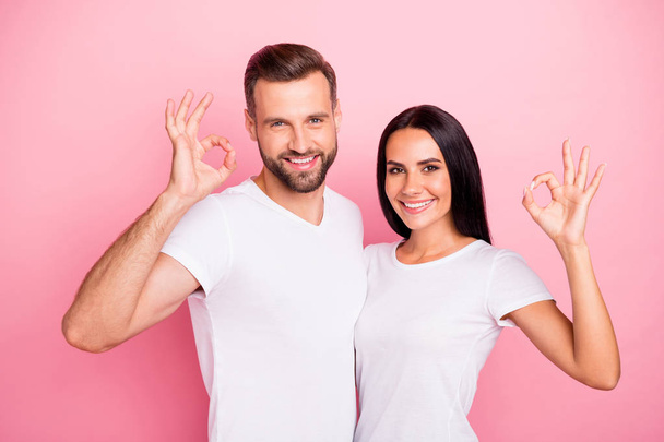 Portrait of his he her she two nice attractive lovely charming cute cheerful cheery spouses embracing showing ok-sign cool ad advert isolated over pink pastel background - Фото, зображення