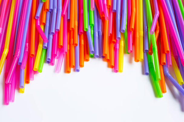 Colorful plastic  straws on white background. - Foto, Bild