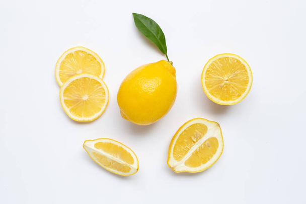Fresh lemon with slices on white - Photo, Image