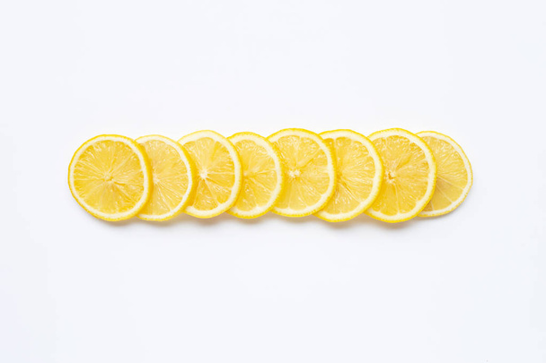 Fresh lemon slices on white - Fotoğraf, Görsel