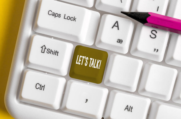 Writing note showing Let S Talk. Business photo showcasing they are suggesting beginning conversation on specific topic White pc keyboard with note paper above the white background. - Photo, Image