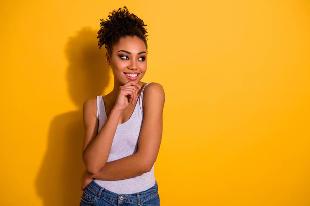 Close up photo cute beautiful amazing she her dark skin lady street look smiling attentive listen concentrated hand arm chin eyes empty space wear casual tank-top isolated vivid yellow background - Foto, Imagem