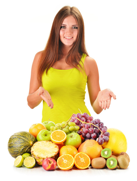 Young woman with assorted fruits isolated on white - Foto, Imagen